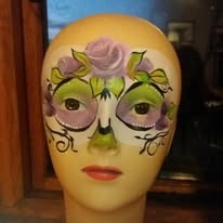 Colourful face-painting design by Sue
