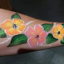 Fun face paint design by Sue